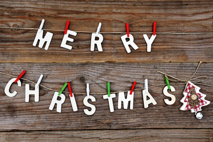 Merry Christmas greeting message on wooden background